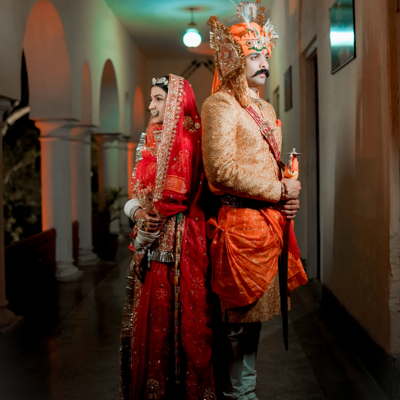 A joyful couple in beautiful traditional clothing.