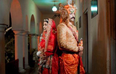 A joyful couple in beautiful traditional clothing.