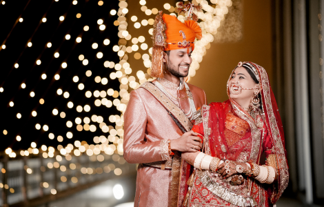 A wedding photographer captures a bride and groom's happy moment.