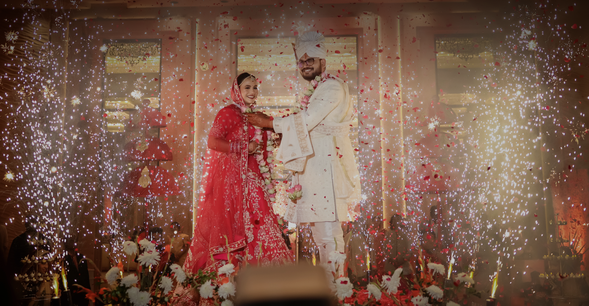 Bride and Groom posing while varmala ceremony.