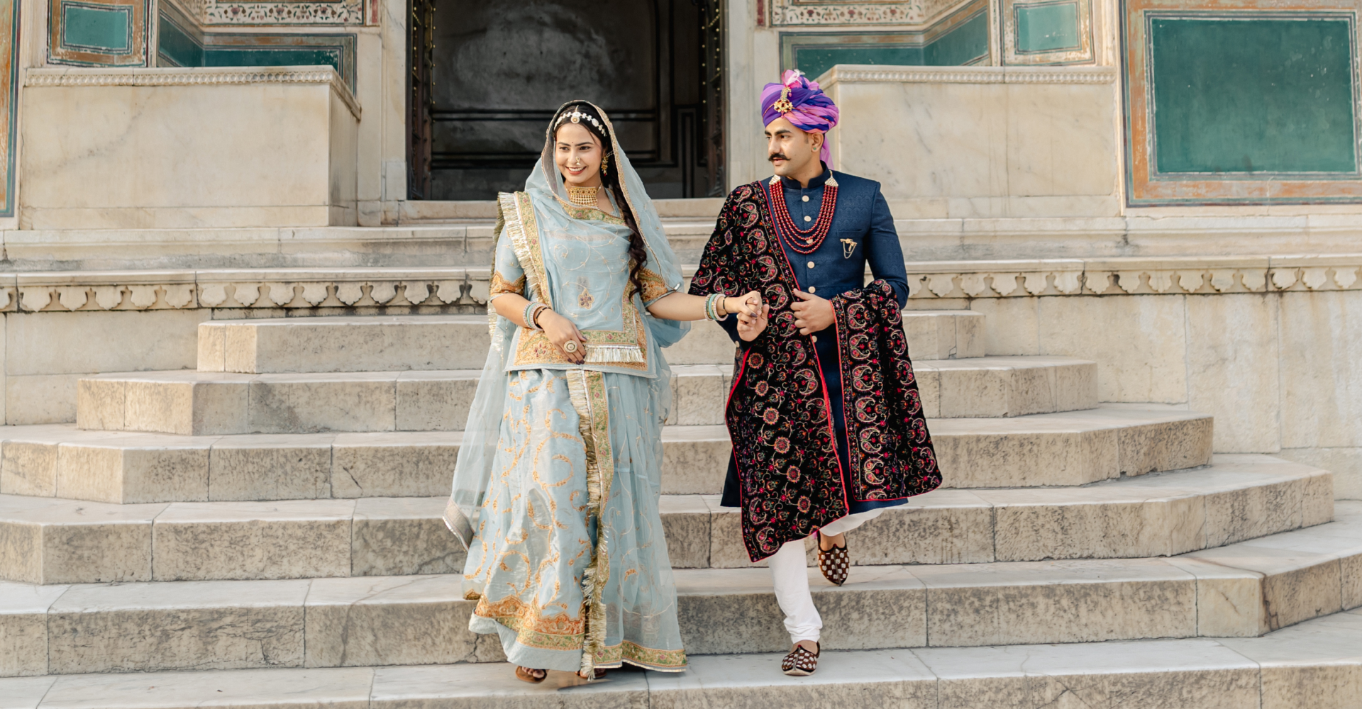 A couple in beautiful Indian garments, showcasing cultural heritage.
