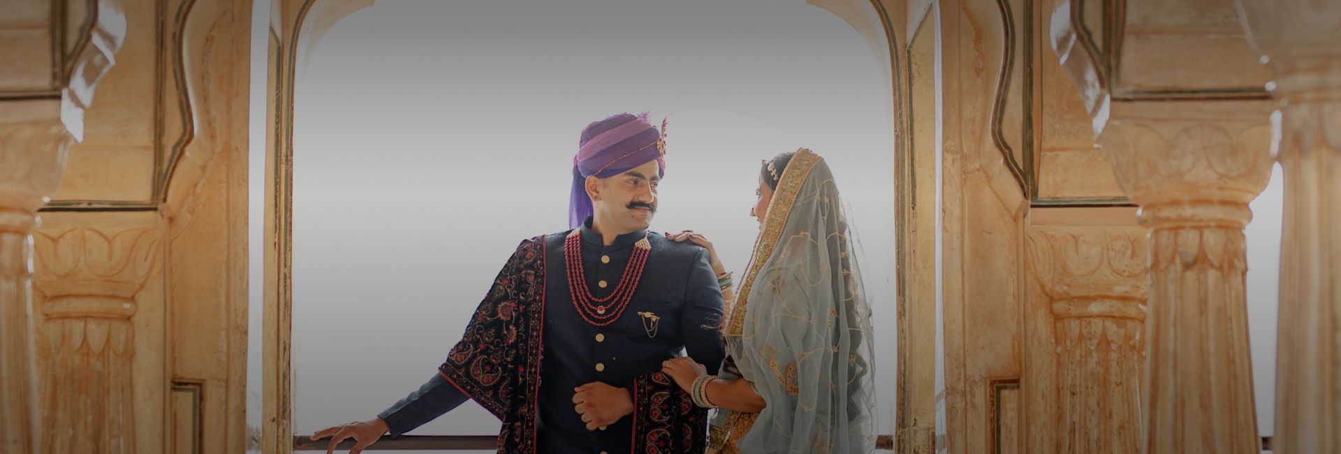 A couple dressed in traditional Indian clothing - banner.