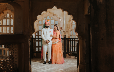 A couple poses romantically in Jaipur, capturing the essence of their pre-wedding shoot against a vibrant backdrop.